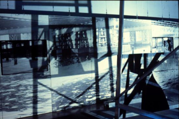 Claire Paquet and Suzanne Paquet. Comme les jours précédents, les géographies du transitoire (installation view). Black and white photographs, aluminium scaffolding, light source (1996)