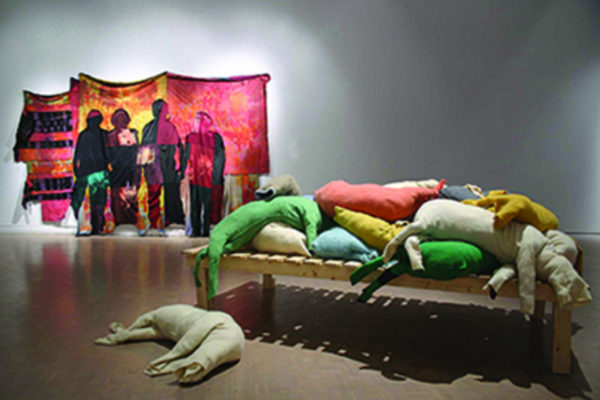 Installation view- (front) Svava Thordis Juliusson Blanket Sacrifice 2003 Woolen blankets, discarded clothing, wood; (rear) Frances Dorsey Dragons’ Teeth...(2014)